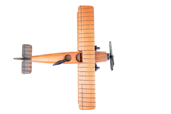 关闭一个木制玩具飞机从顶部被隔离的白色背景 — 图库照片