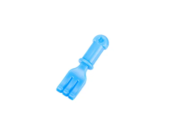 Garfo de brinquedo de plástico minúsculo isolado em um fundo branco — Fotografia de Stock