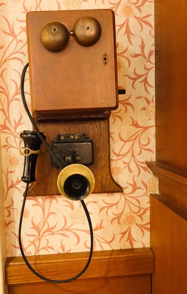 Close up of an old telephone on a wall — Stock Photo, Image