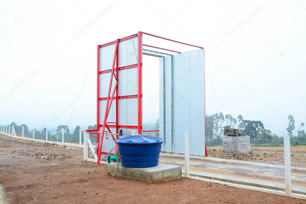 Entrance of a poultry farm with a vehicle desinfection station f