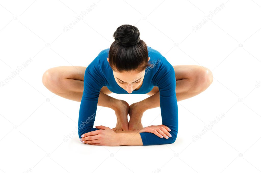 Beautiful healthy woman practices yoga in turquoise body isolated on white background. Yoga asanas. Hatha yoga