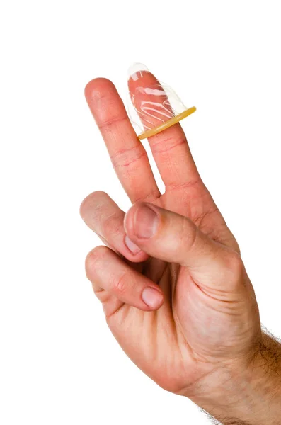 Condom is dressed on the index finger of the mans hand. The gesture is peace. — Stock Photo, Image