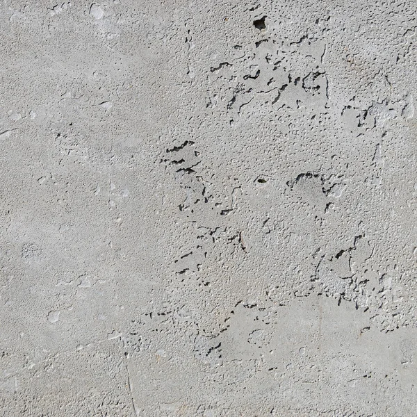 Urban concrete wall background with grooves and bubbles. Cement