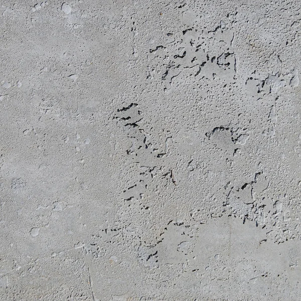 Urban concrete wall background with grooves and bubbles. Cement
