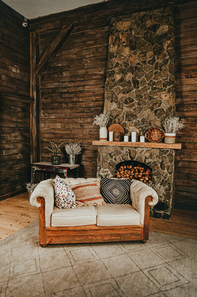 Comfortable home interior with a large soft sofa and a stone fir