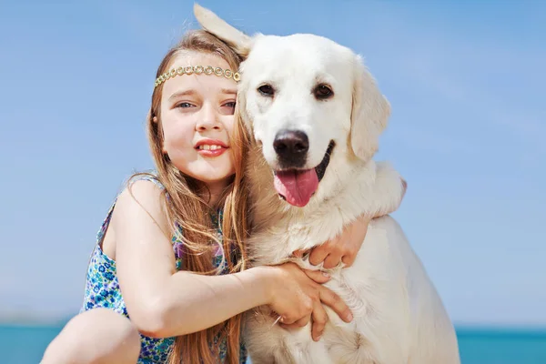 A child with a dog in nature. — Stock Photo, Image