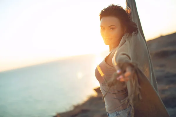 Beautiful woman. Portrait of a young woman in nature with sunset light.