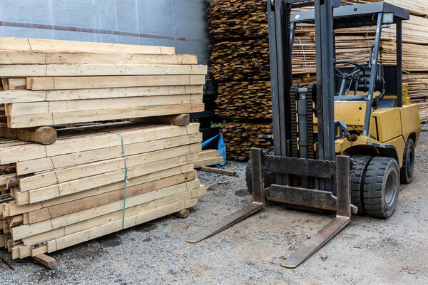 Forklift loader at a sawmill. 