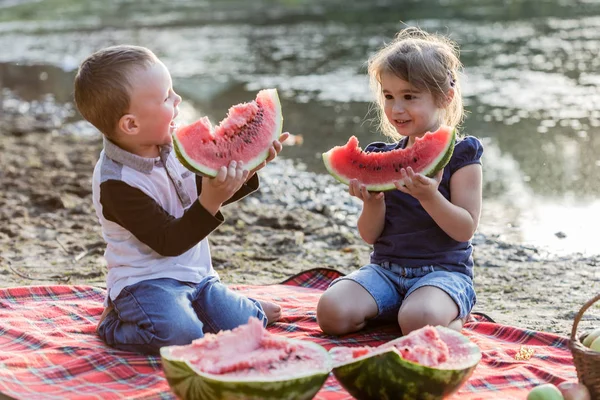 Happy kids with watermelon having fun on the beach. — Stock Photo, Image