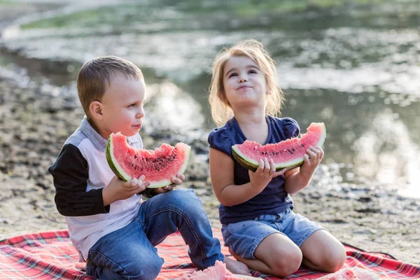 Happy kids with watermelon having fun on the beach. — Stock Photo, Image