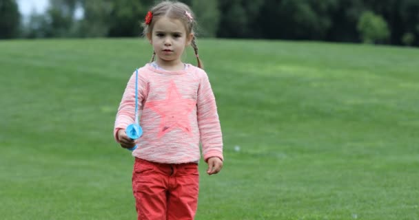 Happy Little Caucasian Girl Making Big Soap Bubbles Having Fun — Stock Video