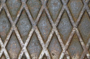 Eski paslı metal doku. Rhombus desenli çelik yüzey.