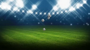 Stadyuma bir sürü futbol topu düşüyor.