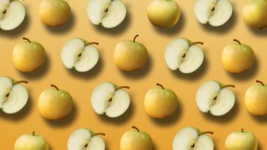 Taze sarı elma sarı arka plan üzerinde renkli meyve deseni. 4k video.