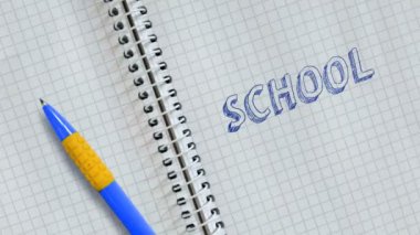 Metin Okulu not defteri ve animasyonlu sayfaüzerine el yazısı.