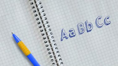  Metin Aabbcc not defteri ve animasyonlu sayfa üzerine el yazısı.