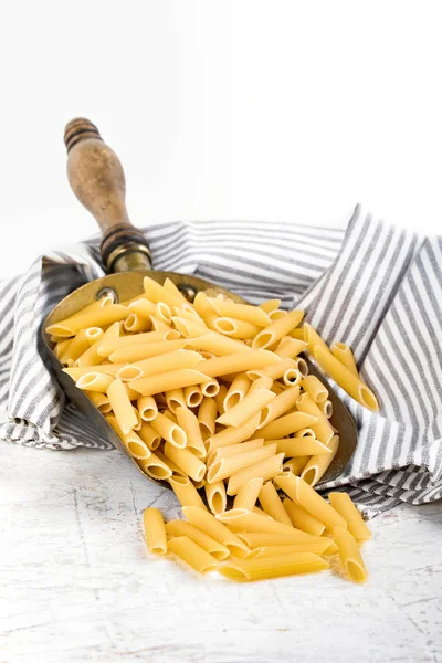 Raw Pasta Type Penne Rigate Copper Bailer White Background — Stock Photo, Image