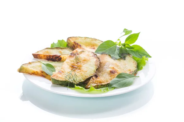 Fried zucchini in a white plate — Stock Photo, Image