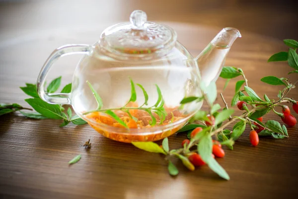 Hot Tea Ripe Red Goji Berries Glass Teapot Wooden Table — Stock Photo, Image