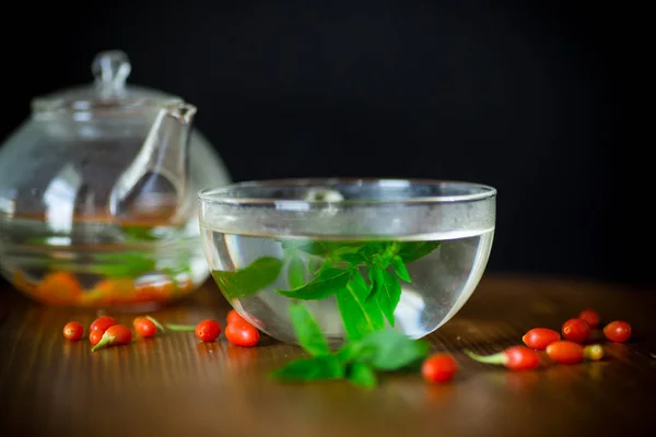 Hot Tea Ripe Red Goji Berries Glass Teapot Isolated Black — Stock Photo, Image