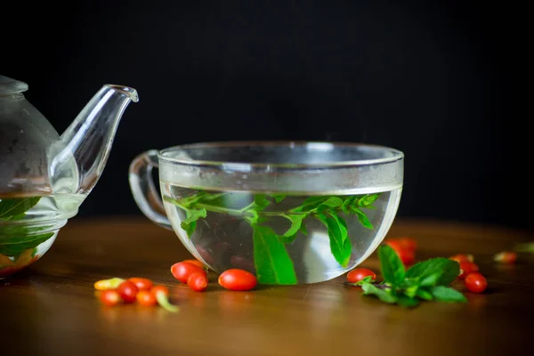 Hot Tea Ripe Red Goji Berries Glass Teapot Isolated Black — Stock Photo, Image