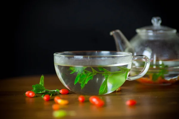 Hot Tea Ripe Red Goji Berries Glass Teapot Isolated Black — Stock Photo, Image