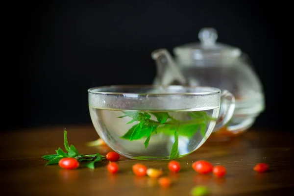 Hot Tea Ripe Red Goji Berries Glass Teapot Isolated Black — Stock Photo, Image