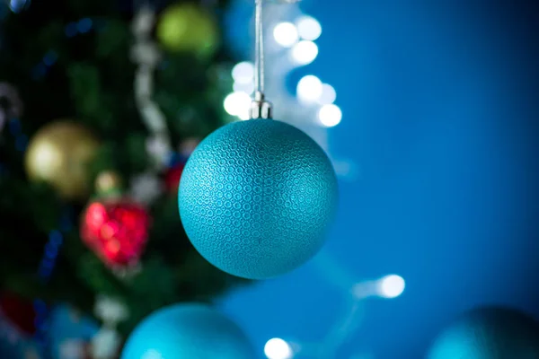 Christmas toys with a Christmas tree on a blue background — Stock Photo, Image