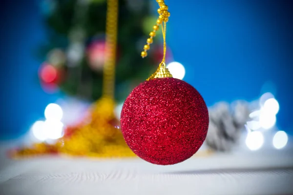 Christmas toys with a Christmas tree on a blue background — Stock Photo, Image