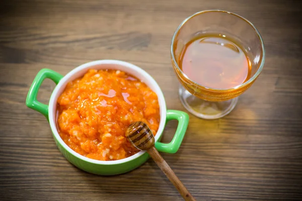 Boiled sweet pumpkin porridge with rice in a plate — Stock Photo, Image