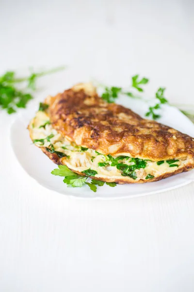 Fried omelet with cauliflower and greens in a plate — Stock Photo, Image