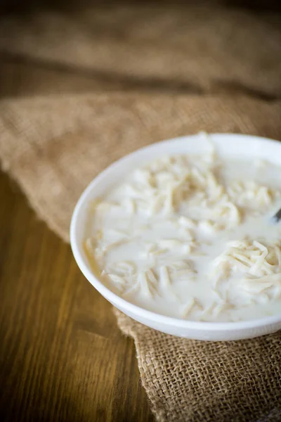 Homemade sweet noodles with milk in a plate — Stock Photo, Image
