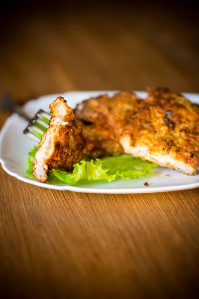 Pork fillet chop fried in batter, in a plate — Stock Photo, Image