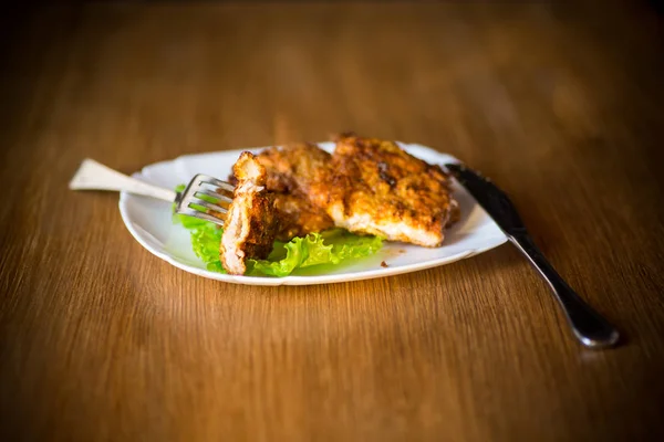 Pork fillet chop fried in batter, in a plate — Stock Photo, Image