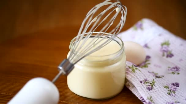 Homemade mayonnaise in a glass jar on a wooden — Stock Video