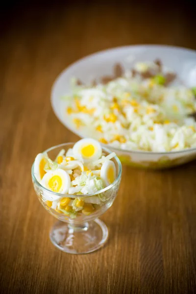 Fresh Peking cabbage salad with boiled eggs, canned corn — Stock Photo, Image