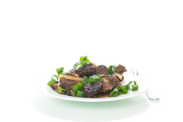 Fried liver with onions in a plate on a white — Stock Photo, Image