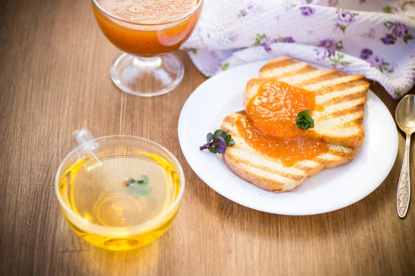 Fried toast with apricot jam in a plate — Stock Photo, Image