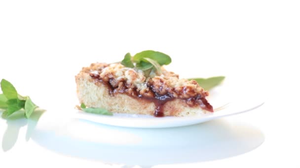 Sweet cake with fruit jam in a plate on a white — Stock Video