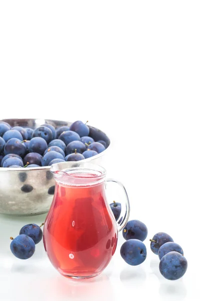 Sweet compote of autumn blue plums isolated on white background — Stock Photo, Image