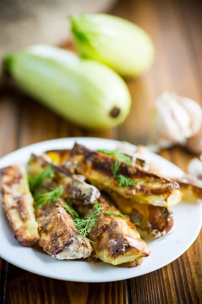 Oven-baked zucchini in batter with garlic and herbs — Stock Photo, Image