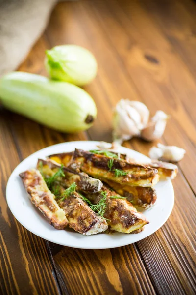 Oven-baked zucchini in batter with garlic and herbs — Stock Photo, Image