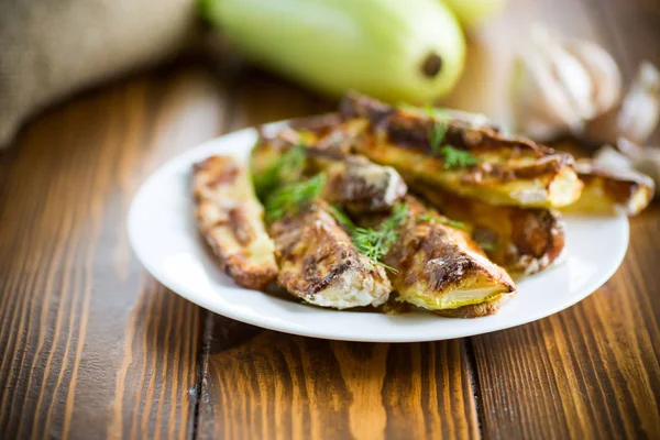 Oven-baked zucchini in batter with garlic and herbs — Stock Photo, Image