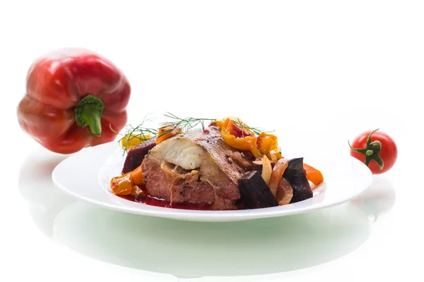 Fish stew with beets and other vegetables in a plate — Stock Photo, Image