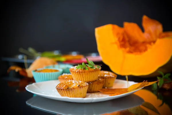 Baked sweet pumpkin muffins with dried apricots inside — Stock Photo, Image