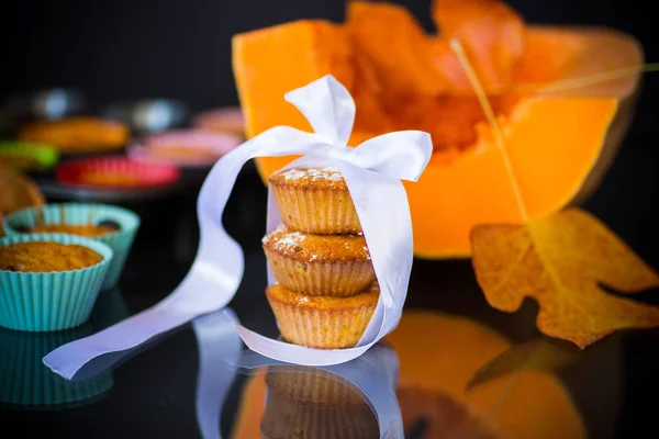 Baked sweet pumpkin muffins with dried apricots inside — Stock Photo, Image