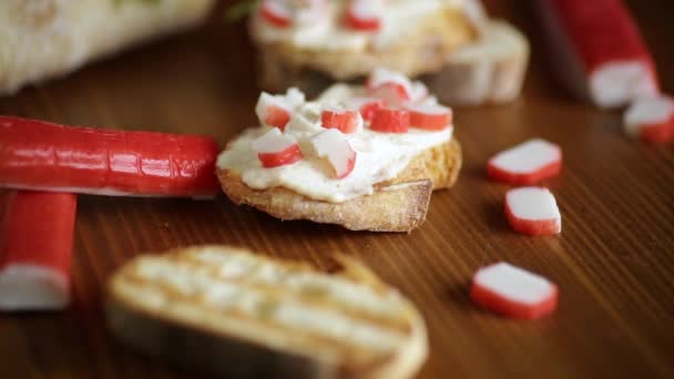 Cheese sandwich and crab sticks on top — Stock Footage Cheese sandwich and crab sticks on top Royalty Free Stock Video