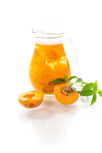 Cold apricot compote in a glass decanter — Stock Photo, Image