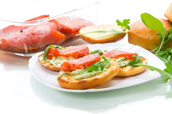 Sandwich with fried bun, cheese spread and red fish in a plate — Stock Photo, Image