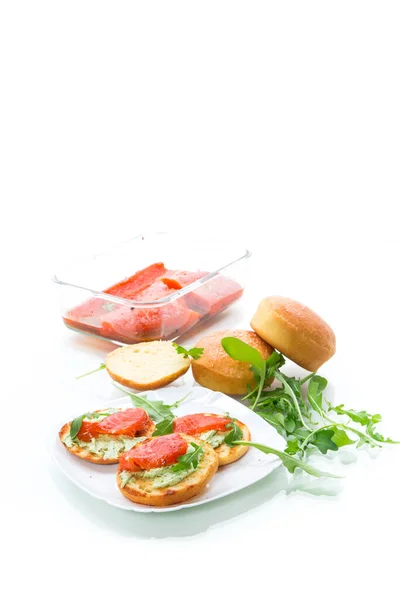 Sandwich with fried bun, cheese spread and red fish in a plate — Stock Photo, Image